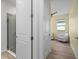 Hallway view leading to Bedroom with chair and crib at 5240 Bentgrass Way, Bradenton, FL 34211