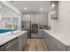 Modern kitchen with stainless steel appliances, sleek cabinets, and an open concept layout at 5240 Bentgrass Way, Bradenton, FL 34211