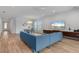 Inviting living area with dining space, modern furniture and large windows providing ample natural light and outdoor views at 5240 Bentgrass Way, Bradenton, FL 34211