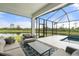Relaxing covered pool patio, ideal for entertaining with stunning lake views at 5240 Bentgrass Way, Bradenton, FL 34211