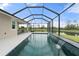 Large screened-in pool area with stunning water views and an outdoor lounging space at 5240 Bentgrass Way, Bradenton, FL 34211