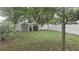 Spacious backyard featuring two storage sheds and a pristine white privacy fence at 5325 Murdock Ave, Sarasota, FL 34231