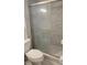 Bathroom with a toilet, shower and hexagon tile at 5325 Murdock Ave, Sarasota, FL 34231