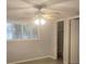 Bedroom with wood floors, ceiling fan and a window at 5325 Murdock Ave, Sarasota, FL 34231
