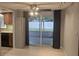 Dining area with sliding glass doors to patio, ceiling fan and seamless access to the kitchen at 5325 Murdock Ave, Sarasota, FL 34231
