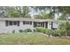 Charming single-story home featuring a well-manicured lawn, updated landscaping, and a welcoming facade at 5325 Murdock Ave, Sarasota, FL 34231