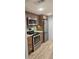 Modern kitchen featuring stainless steel appliances, granite countertops, and beautiful wood cabinets at 5325 Murdock Ave, Sarasota, FL 34231