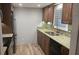 Modern kitchen featuring rich wood cabinetry, granite countertops, and stainless steel appliances at 5325 Murdock Ave, Sarasota, FL 34231