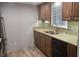 Well-appointed kitchen featuring rich wood cabinetry, granite countertops, and stainless steel appliances at 5325 Murdock Ave, Sarasota, FL 34231