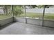 Screened porch with patterned tile floor at 5325 Murdock Ave, Sarasota, FL 34231