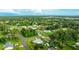 A high aerial shot shows the home's position within a lush, green residential area at 5329 Ansonia Ter, North Port, FL 34287