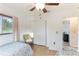 Bedroom showing wood-look floors, closet, and a wicker chair at 5329 Ansonia Ter, North Port, FL 34287
