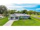 Beautiful single-story home with an attached garage and a well-maintained lawn on a sunny day at 5329 Ansonia Ter, North Port, FL 34287