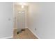 Bright entryway with a decorative rug, light-colored walls, and wood-look flooring at 5329 Ansonia Ter, North Port, FL 34287