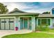 Exterior view of a charming home with a garage and a well-maintained lawn at 5329 Ansonia Ter, North Port, FL 34287