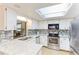 Bright kitchen featuring stainless steel appliances, granite countertops and mosaic tile backsplash at 5329 Ansonia Ter, North Port, FL 34287