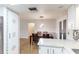 Open kitchen with bar and view into dining room at 5329 Ansonia Ter, North Port, FL 34287