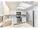 Well-lit kitchen featuring stainless steel appliances and granite countertops at 5329 Ansonia Ter, North Port, FL 34287