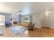 Cozy living room featuring hardwood floors, a fireplace, and large windows at 5329 Ansonia Ter, North Port, FL 34287