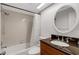 Bathroom features decorative lights, vanity, shower, and bathtub combo at 5356 Royal Palm Ave # 5356, Sarasota, FL 34234