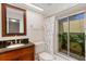 Updated bathroom with stylish sink and shower with access to atrium at 5356 Royal Palm Ave # 5356, Sarasota, FL 34234