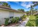 Side exterior view of a well maintained home featuring manicured landscaping at 5356 Royal Palm Ave # 5356, Sarasota, FL 34234