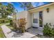 Charming front entrance with plants along sidewalk at 5356 Royal Palm Ave # 5356, Sarasota, FL 34234
