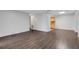 Spacious living room featuring elegant dark wood floors and neutral wall colors offering versatile design options at 5356 Royal Palm Ave # 5356, Sarasota, FL 34234