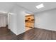 Open concept living room with wood floors and an eat-in kitchen at 5356 Royal Palm Ave # 5356, Sarasota, FL 34234