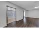 Open-concept living space featuring modern flooring and seamless transition to a bright sunroom at 5356 Royal Palm Ave # 5356, Sarasota, FL 34234