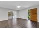 Bright living room with modern floors, connecting to a sunroom through sliding glass doors at 5356 Royal Palm Ave # 5356, Sarasota, FL 34234