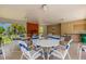 Community Pool area with tables and chairs under a covered patio with restrooms at 5356 Royal Palm Ave # 5356, Sarasota, FL 34234