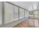 Bright sunroom with tile floors and multiple windows for natural light and views at 5356 Royal Palm Ave # 5356, Sarasota, FL 34234