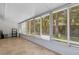 Sunroom with tile flooring and multiple windows at 5356 Royal Palm Ave # 5356, Sarasota, FL 34234