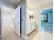 Bathroom with granite countertops and a view of the upstairs landing and bedroom at 5459 Bentgrass Dr # 2-116, Sarasota, FL 34235