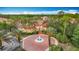 Las Palmas Clubhouse with lush landscaping and a fountain at 5459 Bentgrass Dr # 2-116, Sarasota, FL 34235