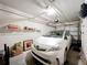 Garage showing a white car parked inside with visible storage racks and door opening system at 5459 Bentgrass Dr # 2-116, Sarasota, FL 34235