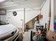 Garage featuring a white car and a storage area with a broom and boxes at 5459 Bentgrass Dr # 2-116, Sarasota, FL 34235