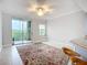 Bright and airy living room with large windows and balcony access at 5459 Bentgrass Dr # 2-116, Sarasota, FL 34235