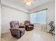 Relaxing living room furnished with reclining chairs and bright natural light at 5459 Bentgrass Dr # 2-116, Sarasota, FL 34235