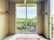 Enjoy this screened lanai with hanging plants and peaceful nature views at 5459 Bentgrass Dr # 2-116, Sarasota, FL 34235