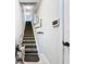 Carpeted staircase with a stair lift offers accessibility and convenience to other floors at 5459 Bentgrass Dr # 2-116, Sarasota, FL 34235