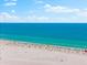 Expansive view of beach with soft white sand and turquoise waters at 5600 Beach Way Dr # 201, Sarasota, FL 34242