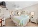 Spacious bedroom offering a bed, a ceiling fan, coordinated furniture, and comfortable decor at 5600 Beach Way Dr # 201, Sarasota, FL 34242