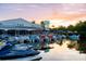 Scenic view of boat rentals at sunset on the waterfront, perfect for cruises and water activities at 5600 Beach Way Dr # 201, Sarasota, FL 34242