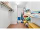 Organized walk-in closet with shelving, hanging racks, and storage space for clothes and linens at 5600 Beach Way Dr # 201, Sarasota, FL 34242