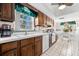 Bright kitchen with ample counter space, wooden cabinets, and stainless steel appliances at 5600 Beach Way Dr # 201, Sarasota, FL 34242