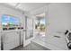 Onsite laundry room with multiple machines and a view at 5600 Beach Way Dr # 201, Sarasota, FL 34242