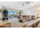 Inviting living room with balcony, neutral tones, and comfortable furnishings for relaxation and enjoyment at 5600 Beach Way Dr # 201, Sarasota, FL 34242