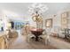 Spacious living room with ceiling fan, balcony access, and comfortable seating arrangement at 5600 Beach Way Dr # 201, Sarasota, FL 34242